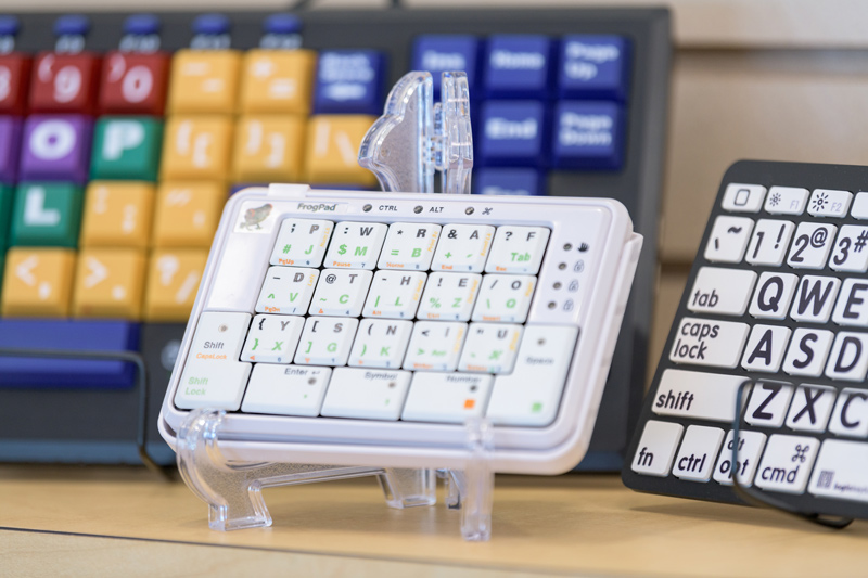 Alternative keyboards: The one in the middle is a one-handed keyboard. The ones in the background and to the right are designed for people with mobility, vision or learning challenges. 