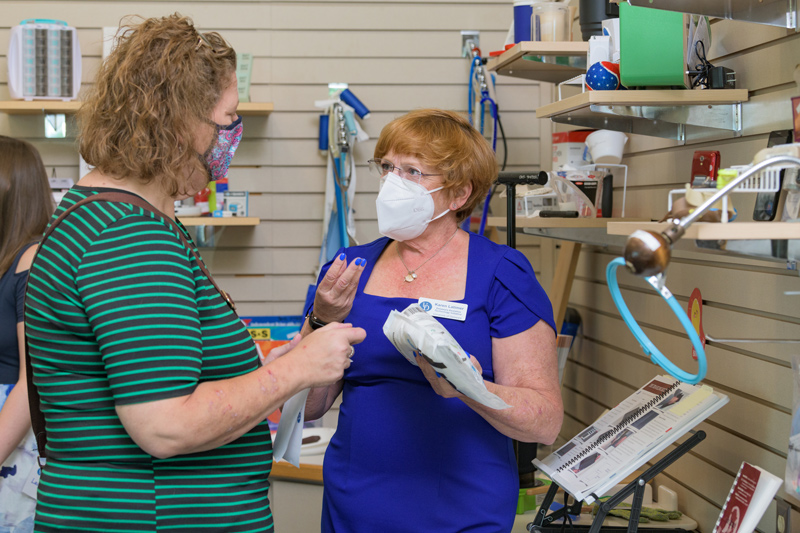 Amy Morten (left) found more than she expected at the center, a reaction that's not surprising to AT specialist Karen Latimer (right), who says the Resource Center is all about showing visitors "what is possible."