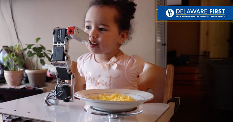 Child using a custom-designed device to help with physical disabilities