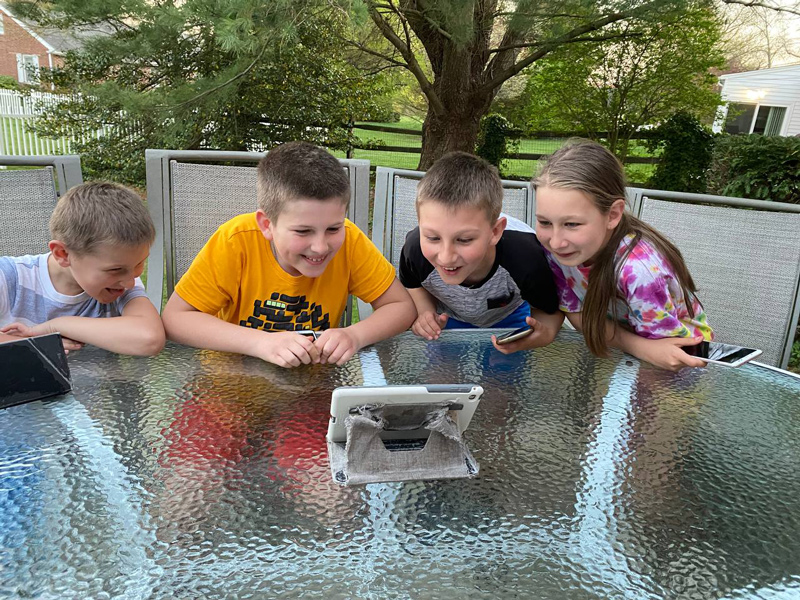  Photo…..Photo 2: The Skrypniuk children from Ukraine enjoy one of the interactive e-books on Stories with Clever Hedgehog. 