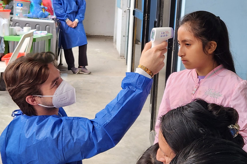 While a senior at UD, Alec MacKinnon embarked on his first medical mission trip to Peru, where he assisted doctors in the intake tent, taking temperatures and other vital signs. 
