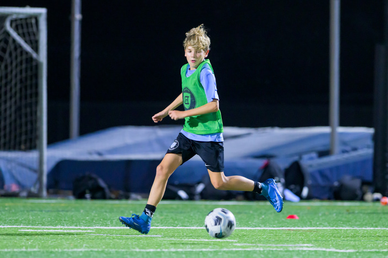 Vinnie Coppola, a soccer player with Delaware Football Club, wears a mouthpiece equipped with sensors to monitor neck strength and head impacts as part of a study led by Thomas Kaminski, professor of kinesiology and applied physiology. 