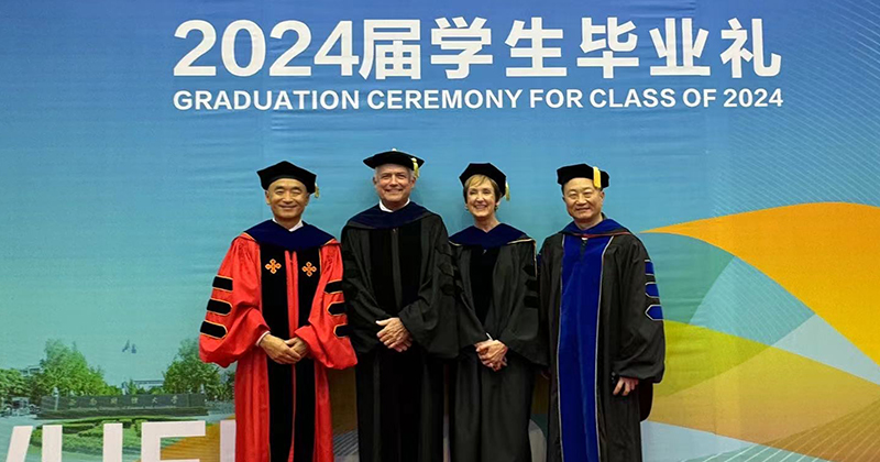 Lerner Dean Oliver Yao poses with  Rick Andrews, senior association dean for faculty and foreign associate dean of the joint institute; Jennifer Gregan, senior assistant dean for global programs and partnerships; and Bintong Chen, professor of operations management and director of the Institute for Financial Services Analytics. 