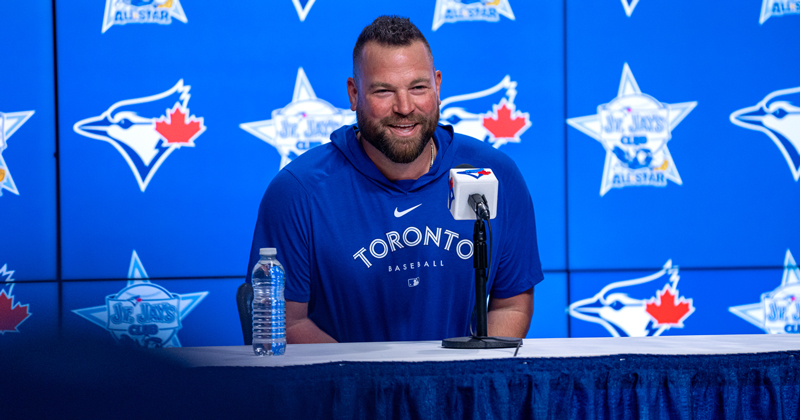 Schneider at press conference 
