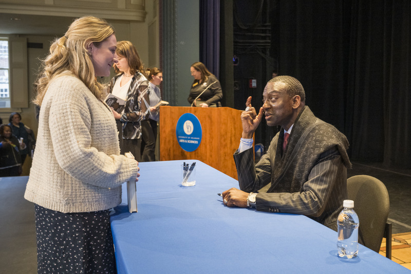 Danielle Linekin, one of the students who participated in a semester-long mini curriculum studying wrongful conviction and exoneration in the United States, speaks with Salaam after the event. 