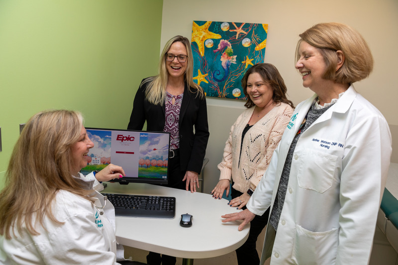 UD School of Nursing alumna Margaret LaFashia, director of workforce partnership development (left, standing), poses with Nemours Children’s Health colleagues (L to R standing) Jennifer McGrath, nursing professional development and clinical educator; Norine Watson, AVP nursing excellence; and (sitting) Pamela Jenkins, clinical nurse educator and coordinator of nursing orientation, nurse residency and the Student Nurse Advancement Program.
