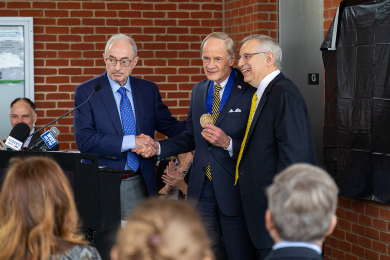 UD President Assanis and Board of Trustees member Donald Puglisi present Sen. Tom Carper with UD’s Medal of Distinction, the University’s highest honor.