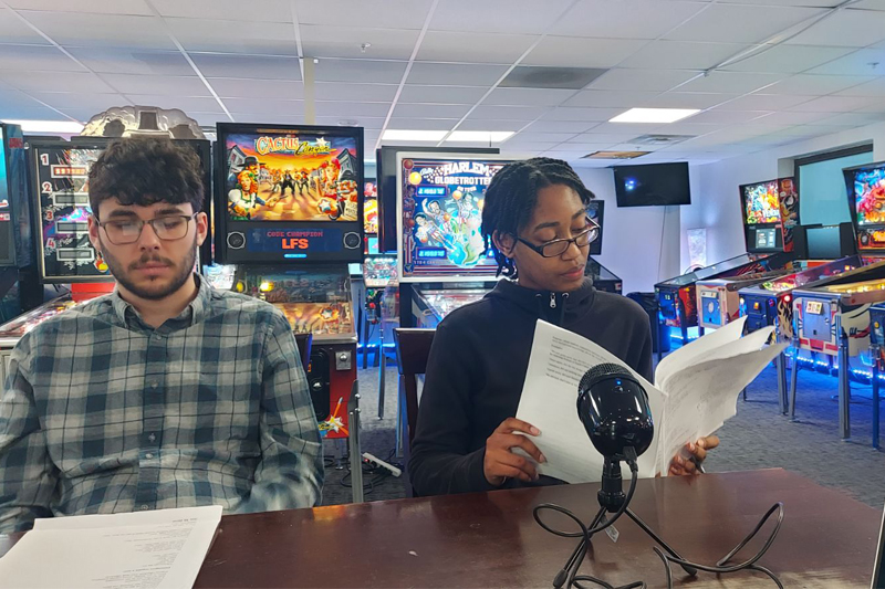 Interns meet to discuss and share programming ideas at the Delaware Pinball Collective near Wilmington.
