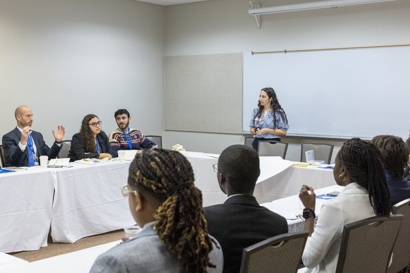 SNF Ithaca Student Leader April Anthony (center) and her fellow cohort members each led group debrief discussions following their case study presentation.