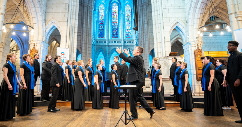 UD Chorale students singing with Director Paul Head