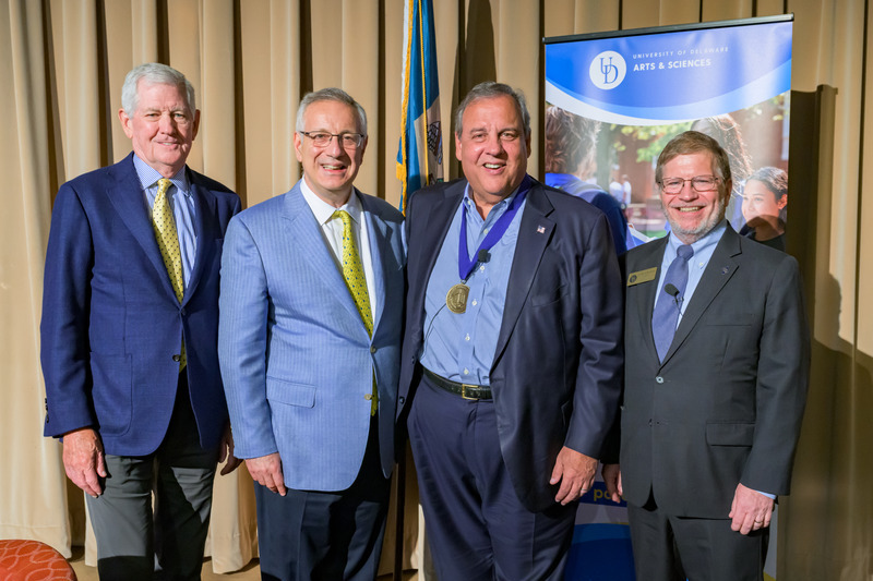Gov. Christie was awarded the University of Delaware Medal of Distinction from President Dennis Assanis (second from left) and Board of Trustees member John Cochran (left). They are joined here by David P. Redlawsk, James R. Soles Professor and Chair of UD’s Department of Political Science and International Relations (right).