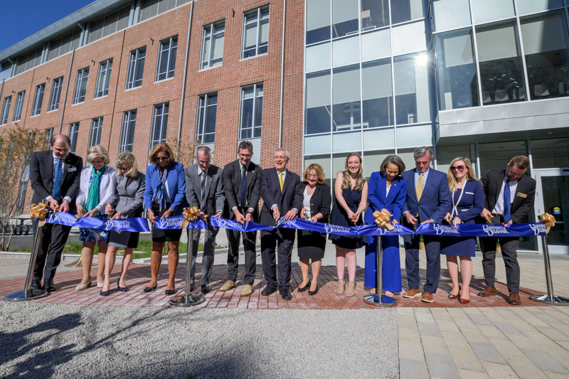 Wielding golden scissors, University of Delaware officials join with faculty, elected officials and a graduate student to cut the proverbial ribbon, marking the official opening of UD’s new Building X. Among them are (left to right) Miguel Garcia-Diaz, vice president for research, scholarship and innovation; Professor Debra Hess Norris, chair and professor in the Department of Art Conservation and a member of UD’s Board of Trustees; Provost Laura Carlson; Terri Kelly, chair of UD’s Board of Trustees; Newark Mayor Jerry Clifton; Delaware Gov. Matt Meyer; UD President Dennis Assanis and first lady Eleni Assanis; doctoral student Skye Brand; U.S. Senator Lisa Blunt Rochester; Wilmington Mayor John Carney; State Treasurer Colleen Davis; and Caleb Everett, dean of the College of Arts and Sciences.