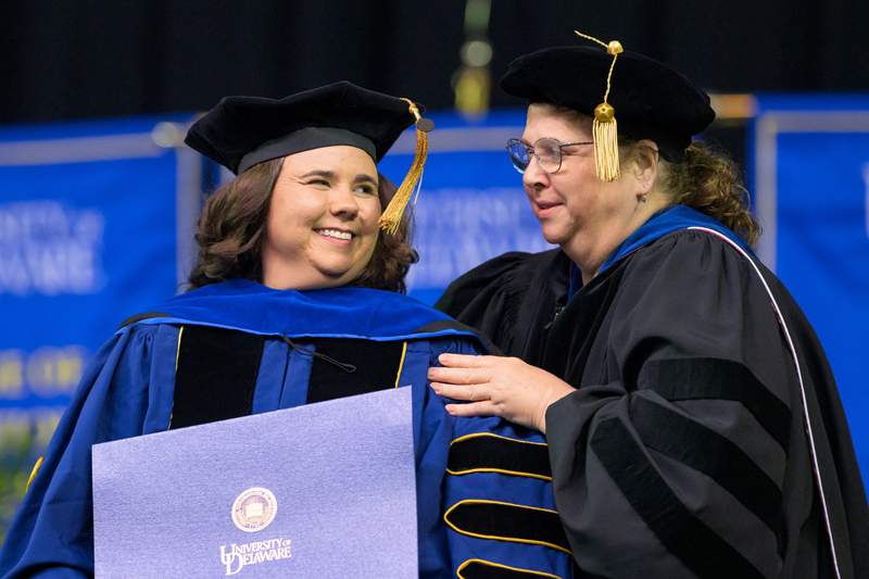 After spending more than two years doing lab work in Pittsburgh, Samantha Gillis-Nelson was thrilled to be back on the UD campus to be hooded by Erica Selva.