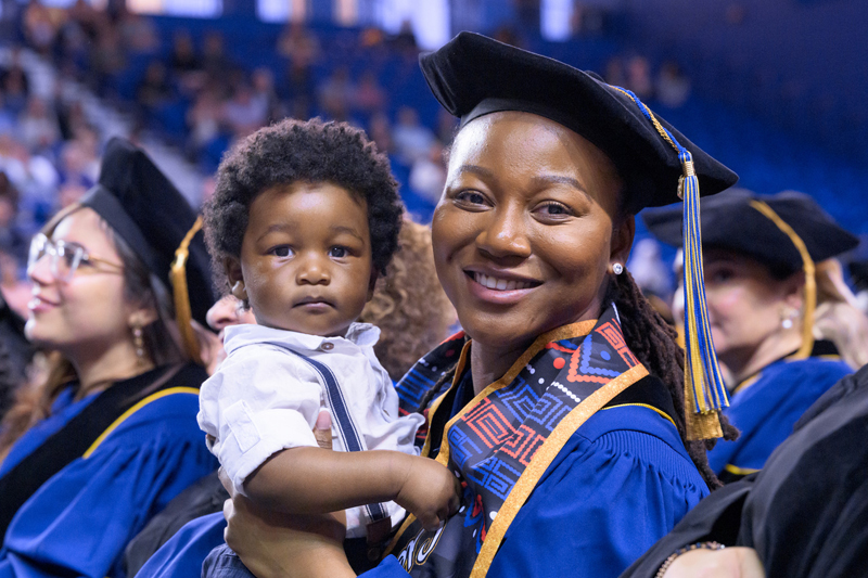 Proud mother Sarah Clerjuste crossed the stage with her son, Emerson, who was born just under a year ago.
