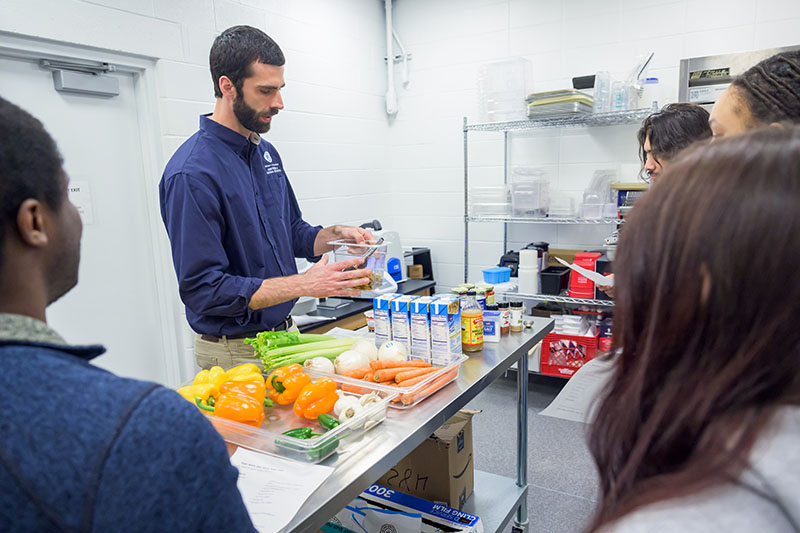 Michael Crossley talks to his students about how to prepare Sago worm and black bean chili.