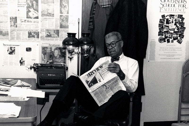 Chuck Stone reading one of his favorite student newspapers. 