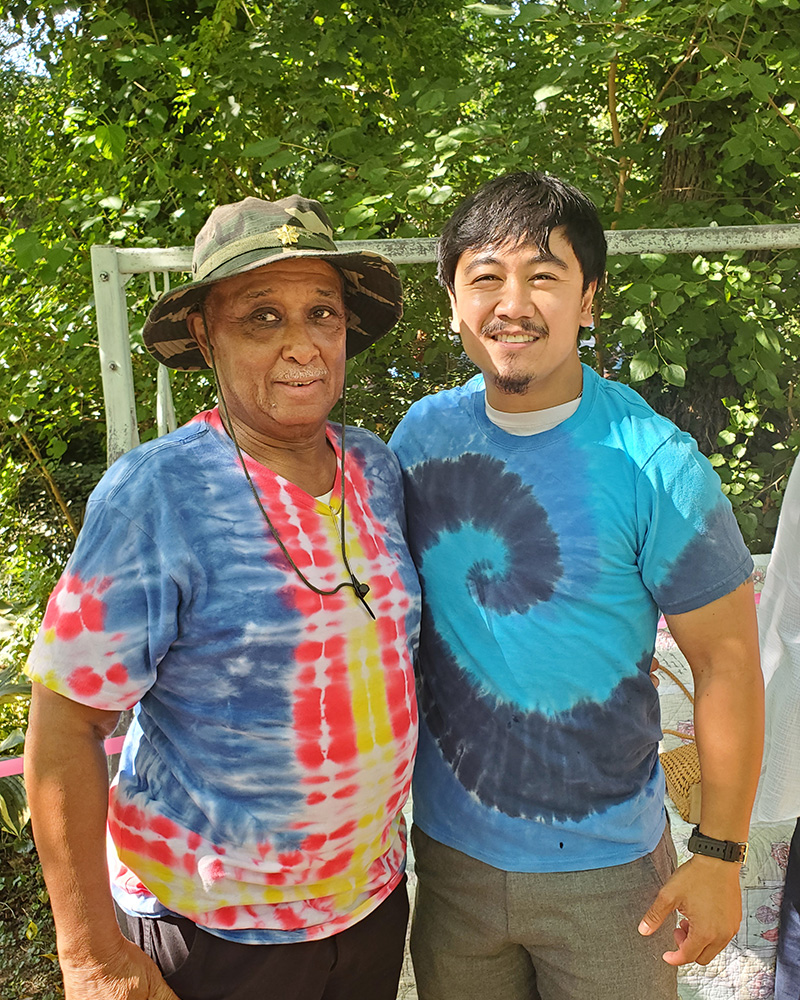 Charles Hammond (left), president of the Milford Museum’s board of directors, with Jay Amamio at the museum’s annual Hippiefest community event. 