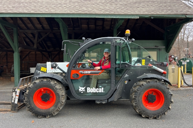 Long operates a Bobcat telehandler to move pallets of stone needed for garden improvements in Winterthur’s Enchanted Woods. 