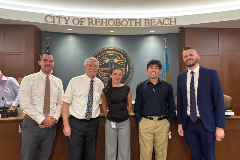 From left to right: Evan Miller, assistant city manager of Rehoboth Beach and a former City Management Fellow, poses for a photo with Stan Mills, mayor of Rehoboth Beach; Gillian Klemas, fellow; Ray Kalmanowitz, fellow; and Taylour Tedder, city manager of Rehoboth Beach. 