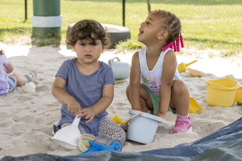 Toddlers enjoy sensory play in a sandbox UD’s Early Learning Center, which serves children from six-weeks through age 8.
