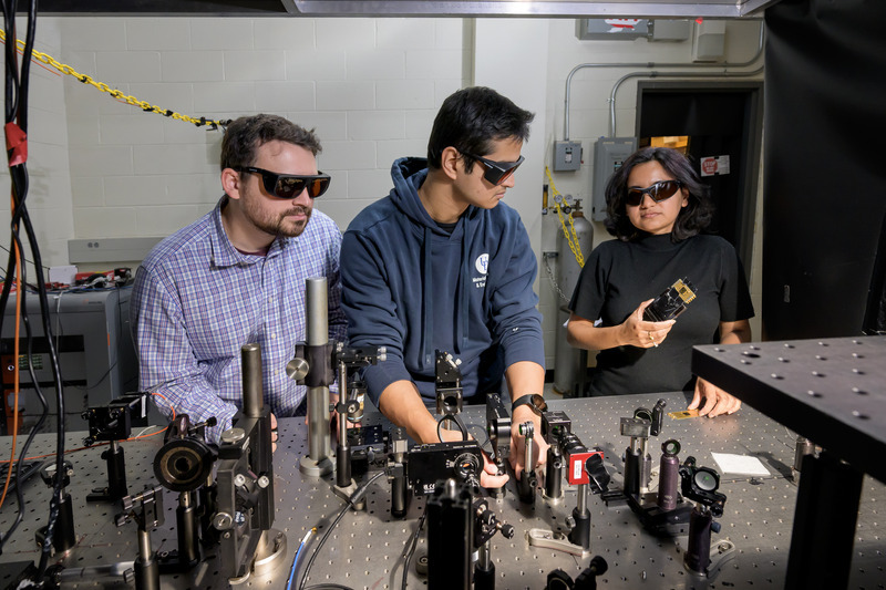 Chakraborty lab members develop optical setups to probe light emission from atomically thin materials.