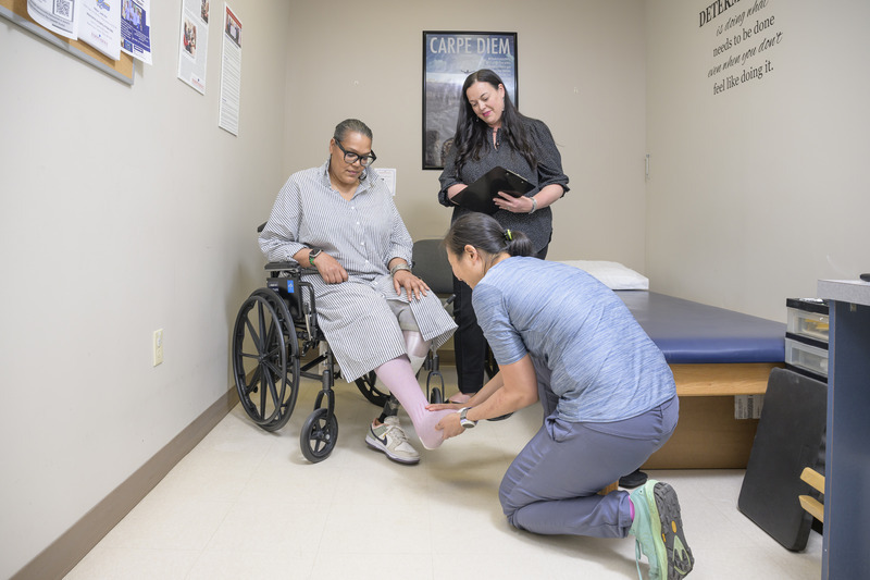 Results of a clinical trial by UDPT researchers found that comorbidity screenings conducted by prosthetists may be feasible and don’t significantly increase visit time. Pictured here, Jocelyn Wong Neill, a certified prosthetist-orthotist at Independence Prosthetics-Orthotics, asks a series of questions during a routine prosthetist appointment.